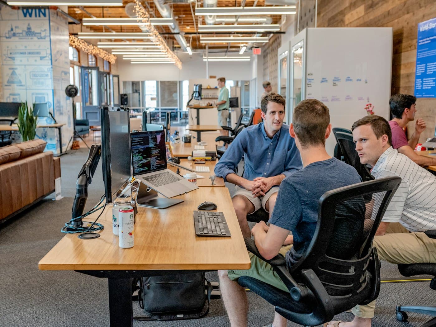 Team collaborating around a table in a professional workspace