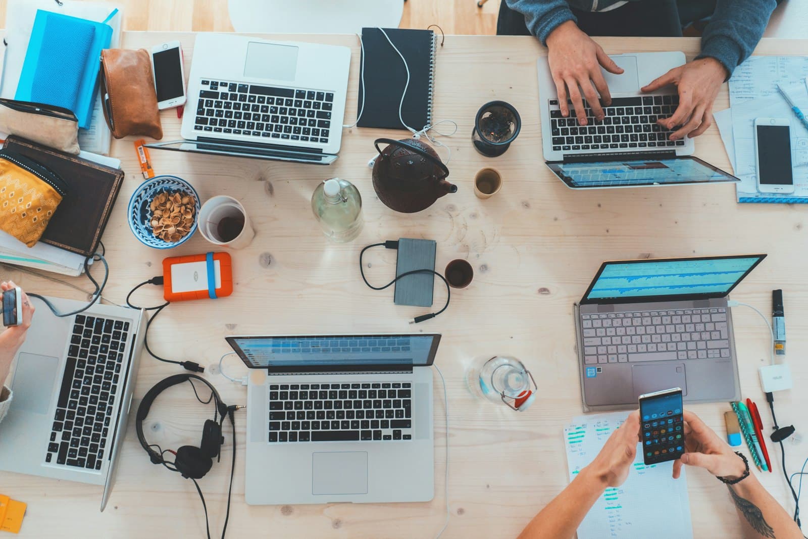Collaborative desks representing OneSource OS operational software direction